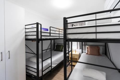 a couple of bunk beds in a room at BIG4 Tasman Holiday Parks - Rowes Bay in Townsville