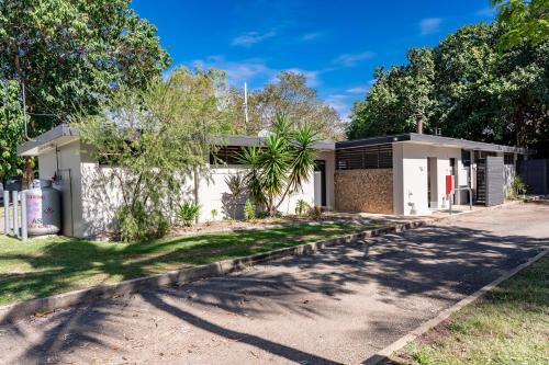 a house on a street with trees in front of it at BIG4 Tasman Holiday Parks - Rowes Bay in Townsville