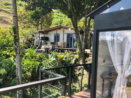a view of a house from the balcony at La Comarca Guatapé in Guatapé