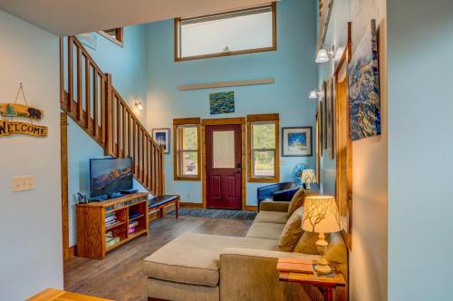 a living room with a couch and a tv at Barnes on Boundary Unit A in West Yellowstone