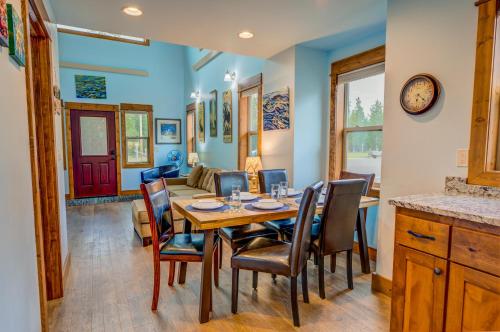 a dining room with a table and chairs at Barnes on Boundary Unit A in West Yellowstone