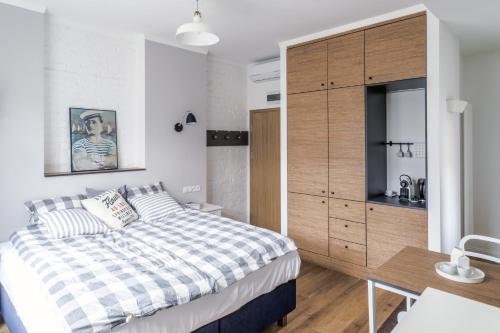 Postel nebo postele na pokoji v ubytování Apartamenty Solo na Molo