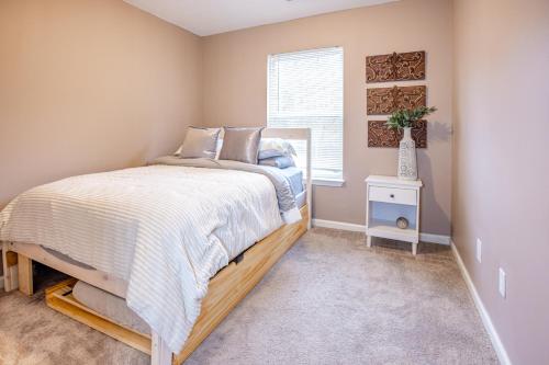 a bedroom with a bed and a window at LUX - Downtown Oasis - Pool Table! Free Parking! in Lexington