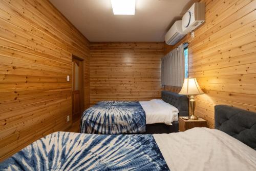 En eller flere senge i et værelse på S-Villa Nasu 2nd