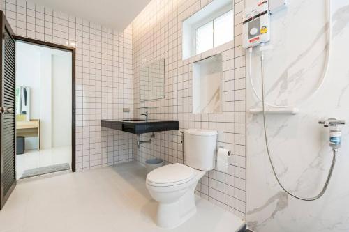 a bathroom with a toilet and a sink and a shower at golf pool villa close patong and phuket town in Kathu