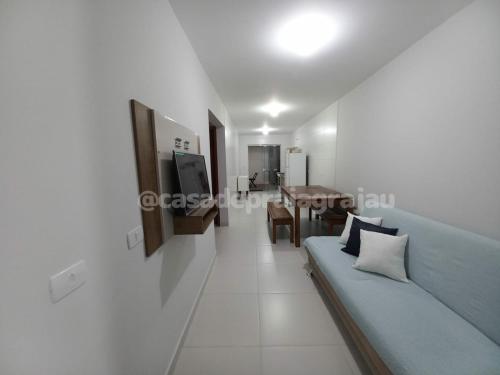 Ein Sitzbereich in der Unterkunft @casadepraiagrajau