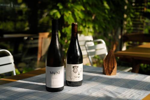 two bottles of wine sitting on a table at Lodge Norheim in Asahikawa