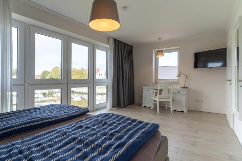 Postel nebo postele na pokoji v ubytování Poller 25-Haus Alte Werft