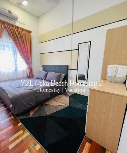 a bedroom with a bed and a mirror at CozyLuxury Homestay Paka 3-7pax near Paka Beach and surrounding many Restaurant - Y2L Homestay 2 in Paka
