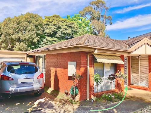 a car is parked in front of a house at PRIVATE ROOM 1 and PRIVATE ROOM 3 beside Monash University in Clayton in Clayton North