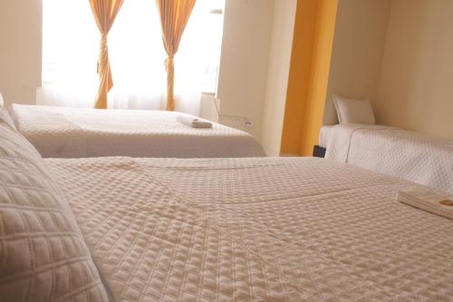 Katil atau katil-katil dalam bilik di Gran Hotel