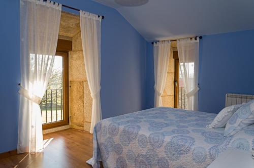 Кровать или кровати в номере Casa Do Ghabino