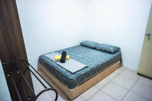 Ένα ή περισσότερα κρεβάτια σε δωμάτιο στο MPE Guesthouse