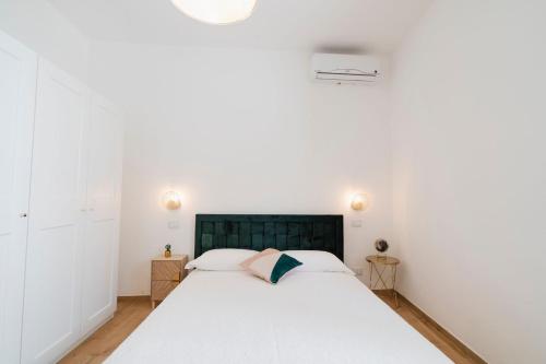 Postel nebo postele na pokoji v ubytování Le CORALLINE APARTMENTS