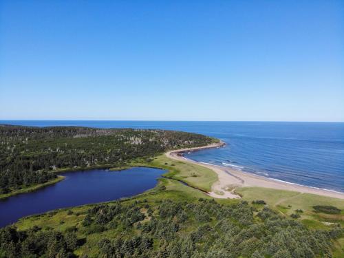 an aerial view of a beach and the ocean at Colindale Beach Villas in Port Hood