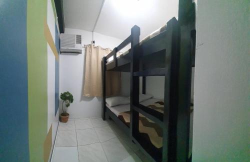 a room with a bunk bed in a room at Villa Tomasa Boracay Dmall in Boracay