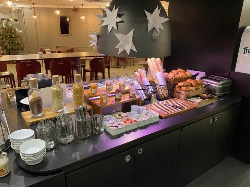a buffet line with food on top of a table at Campanile Nogent-Sur-Marne in Nogent-sur-Marne