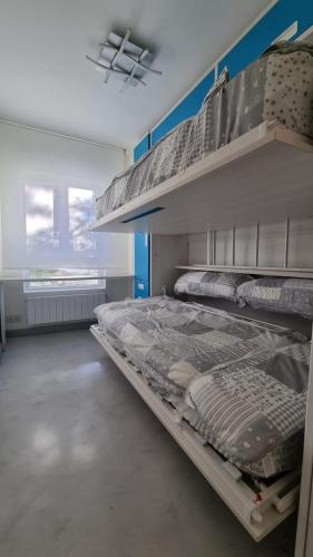 a large room with two bunk beds in it at SARDINERO in Santander