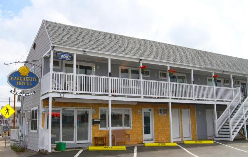 a building with a balcony on the side of it at Marguerite Motel in Hampton