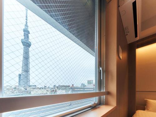 a window with a view of the eiffel tower at Rakuten STAY Tokyo Asakusa Twin Room in Tokyo