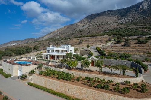 a villa with a view of a mountain at Tholos Boutique Houses in Kavoúsion