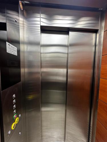 a stainless steel elevator in a building at La Vista Luxury Villa in Ohrid