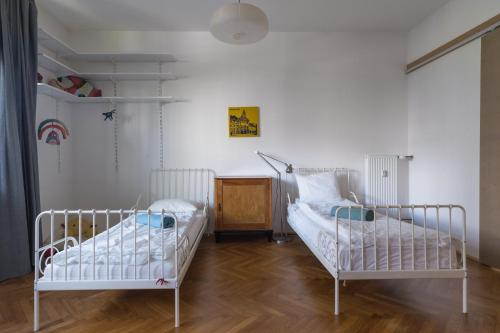 Postel nebo postele na pokoji v ubytování Family apartment in the city centre - FREE parking garage