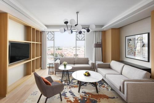 a living room with a couch and a table at Crowne Plaza - Jeddah Al Salam by IHG in Jeddah