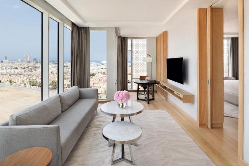 a living room with a couch and a tv at Crowne Plaza - Jeddah Al Salam by IHG in Jeddah