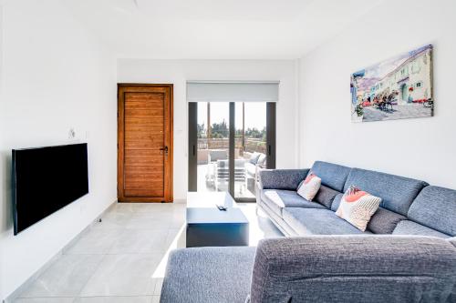 A seating area at Villa Elpida TWO by Ezoria Villas in Timi, Paphos