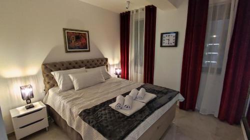 Postel nebo postele na pokoji v ubytování Lux Apartman Crnjanski IV, Jagodina