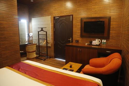 Postel nebo postele na pokoji v ubytování JHARNA RESORT