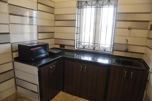 Kuchyň nebo kuchyňský kout v ubytování JHARNA RESORT
