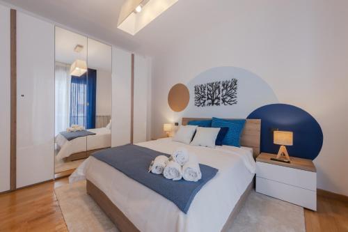 Postel nebo postele na pokoji v ubytování Nordic Style - 5 min dall'Arena & Parcheggio