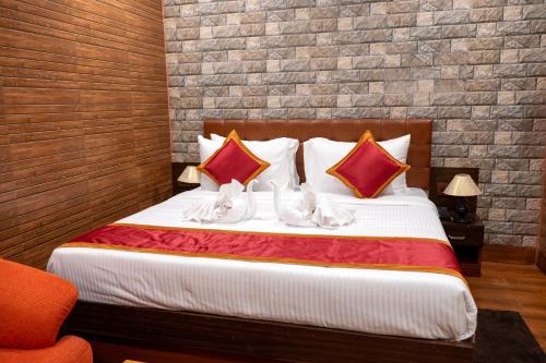 Postel nebo postele na pokoji v ubytování JHARNA RESORT