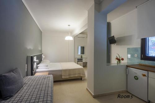 Ένα ή περισσότερα κρεβάτια σε δωμάτιο στο Hotel Oriana - Adults Only