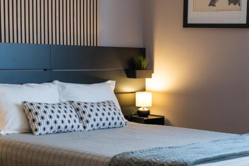 Un ou plusieurs lits dans un hébergement de l'établissement Villaggio Tranquillo - bambnb
