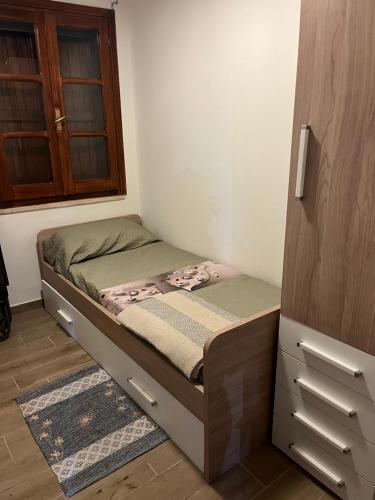 Giường trong phòng chung tại Appartamento al mare