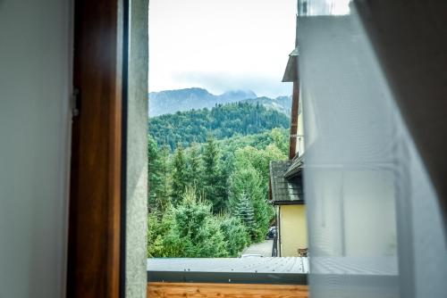 a view from a window of a mountain at My Tatra Residence in Zakopane