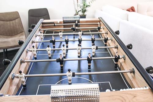 a game of billiards in a living room at Chambres d'hôtes du Val d'Asson in Montaigu-Vendée