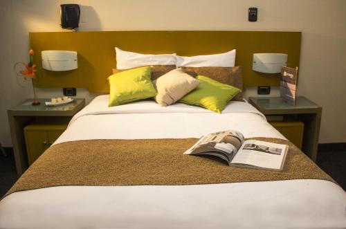 Ein Bett oder Betten in einem Zimmer der Unterkunft Hotel Sunqu
