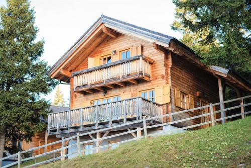 a log cabin with a balcony on a hill at Holiday home in Stefan in the Lavanttal with balcony in Elsenbrunn