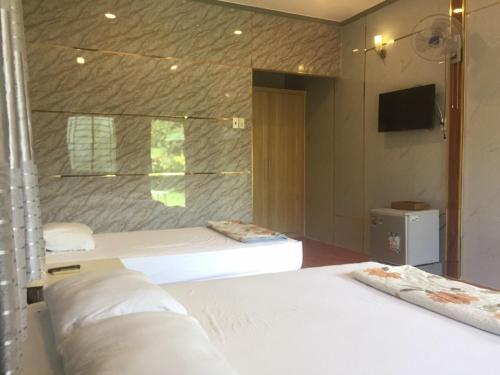 Giường trong phòng chung tại Mekong Riverside Homestay