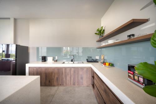 a kitchen with a sink and a counter top at The Sense Apartment - Modern, Near My An Beach in Da Nang