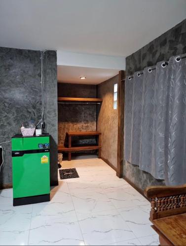 Postel nebo postele na pokoji v ubytování บ้านภทรพรรณ ขุนยวม แม่ฮ่องสอน PATARAPHAN HOUSE, Khunyuam, Maehongson, Thailand
