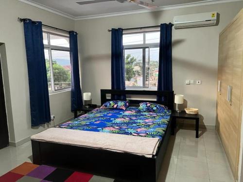 Ένα ή περισσότερα κρεβάτια σε δωμάτιο στο Essmante Villa - Comunal Pool, Gym, Tennis & Basketball Court