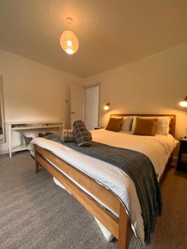 a bedroom with a large bed in a room at The Annex, Escape to the Country in Salcombe