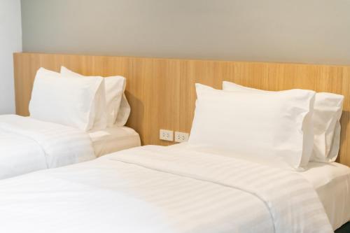 Ένα ή περισσότερα κρεβάτια σε δωμάτιο στο Goodday Hotel