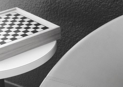 a chess board sitting on top of a white chair at Ibis Budget Agen in Le Passage