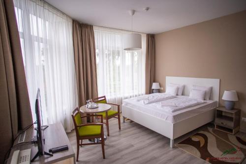 Un ou plusieurs lits dans un hébergement de l'établissement Selfness Hotel Vadvirág Mátraszentimre